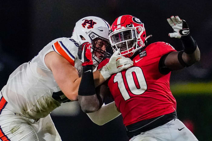 Oct 3, 2020; Athens, Georgia, USA; Auburn Tigers offensive lineman Austin Troxell (68) and Georgia Bulldogs defensive lineman Malik Herring (10) battle along the line during the second half at Sanford Stadium. Mandatory Credit: Dale Zanine-USA TODAY Sports